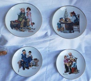 lot 236 image: Norman Rockwell Plates The Toymaker, The Lighthouse Keepers Daughter, For a Good Boy and The Cobbler
