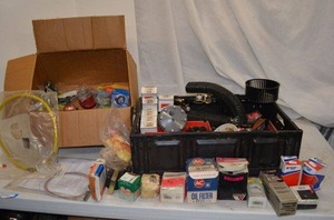 lot 112 image: Misc. Car Parts including Distributor caps, blower parts, oil filter, Bearings, lights, AC parts, Ignition, Cruise control