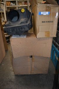 lot 124 image: AC Air Filter, GM Seat Riser Part, Heater Core