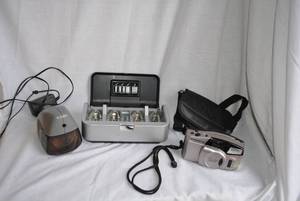 lot 293 image: Olympus Camera, Energizer Battery Charger, Electric Pencil Sharpener