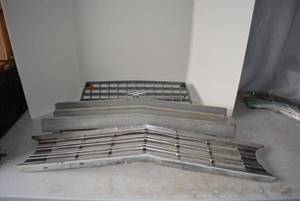 lot 328 image: 3 Front Grills as shown, 2 are Chevy, 1 is unmarked