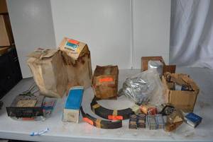 lot 334 image: Old Car Parts Includes 1930s Brake Pads, 1970s Water Pump, Old Light Bulbs