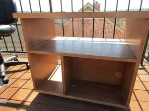 lot 15 image: Light weight square top wooden table with 3 tier shelving