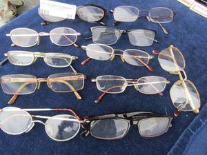 lot 35 image: 11 pair of reading glasses- Versace, Optix sphere, Foster Grant, and more