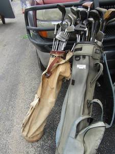 lot 44 image: Blue golf bag with merit clubs and Tan bag    CLUBS INCL. TAYLOR MADE, H& B, LIGHTENING