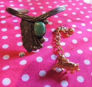 lot 203 image: Gold Dog Tie Pin and White metal and stone cuff bracelet, marked NT