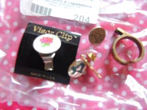 lot 204 image: Pink rose visor clip, brass bottle opener ring, gold female pin, Turquoise inlaid TEXAS pin    DCBE 96 pin,