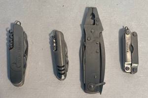lot 139 image: True Value Pocket Knife with plyers, Ducks Unlimited Swiss Pocket Knife, Husky Pocket Knife with plyers and Swiss Pocket Knife