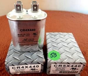 lot 53 image: CR5X440  5 Mfd 440V Oval Capacitor (X2) NIB