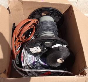 lot 87 image: LARGE BOX WITH CONDUIT, WIRE, AND LEATHER STRAPS AS SHOWN