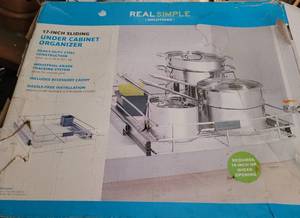 lot 15 image: 17-INCH SLIDING UNDER CABINET HEAVY DUTY STEEL CONSTRUCTION ORGANIZER IN BOX AS SHOWN.