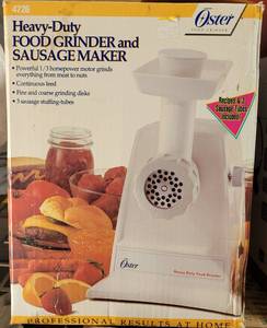 lot 31 image: OSTER HEAVY-DUTY FOOD GRINDER AND SAUSAGE MAKER 4726 IN BOX AS SHOWN.