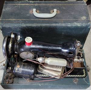 lot 46 image: VINTAGE PORTABLE GOOD HOUSEKEEPER EUREKA SEWING MACHINE WITH CASE AS SHOWN. MADE IN JAPAN.
