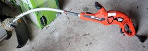 lot 64 image: BLACK & DECKER ELECTRIC GRASSHOG XP TRIMMER AS SHOWN.