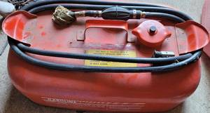 lot 77 image: 3 GALLON METAL GAS TANK WITH HOSE AS SHOWN.