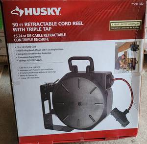 lot 104 image: HUSKY 50 FT RETRACTABLE CORD REEL 291 322 WITH TRIPLE TAP IN UNOPENED BOX AS SHOWN.