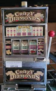 lot 118 image: CRAZY DIAMONDS GAMING MACHINE STYLE BANK AS SHOWN.