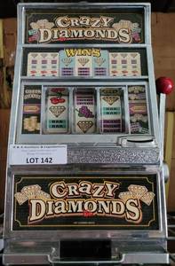 lot 142 image: CRAZY DIAMONDS GAMING MACHINE STYLE BANK AS SHOWN.