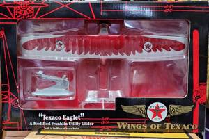 lot 162 image: ERTL COLLECTIBLES WINGS OF TEXACO TEXACO EAGLET DIE CAST GLIDER IN ORIGINAL BOX AS SHOWN.