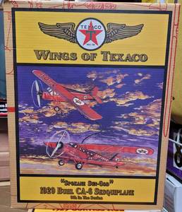 lot 163 image: ERTL COLLECTIBLES WINGS OF TEXACO SPOKANE SUN GOD 1929 BUHL CA-6 SESQUIPLANE DIE CAST METAL BANK IN ORIGINAL BOX AS SHOWN.