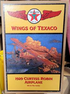 lot 164 image: ERTL COLLECTIBLES WINGS OF TEXACO 1929 CURTIS ROBIN AIRPLANE DIE CAST METAL BANK IN ORIGINAL BOX AS SHOWN.
