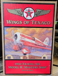 lot 165 image: ERTL COLLECTIBLES WINGS OF TEXACO 1930 TRAVEL AIR MODEL R MYSTERY SHIP DIE CAST METAL BANK IN ORIGINAL BOX AS SHOWN.