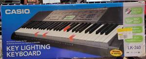 lot 183 image: CASIO KEY LIGHTING KEYBOARD LK-240 IN BOX AS SHOWN.