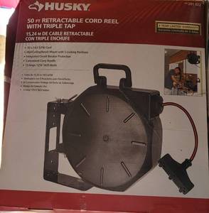 lot 201 image: HUSKY 50 FT RETRACTABLE CORD REEL 291 322 WITH TRIPLE TAP IN BOX AS SHOWN.