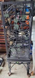 lot 240 image: HEAVY WROUGHT IRON WINE RACK WITH DECORATIVE GRAPESVINE MOTIF ON DOOR AS SHOWN.
