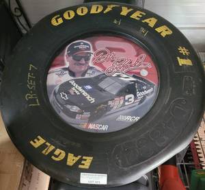 lot 321 image: RACING REFLECTIONS DALE EARNHARD COMMEMORATIVE GOOD YEAR RACING TIRE COLLECTIBLE AS SHOWN.