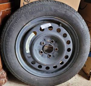 lot 330 image: CONTINENTAL 13590R16 SPARE TIRE AS SHOWN.