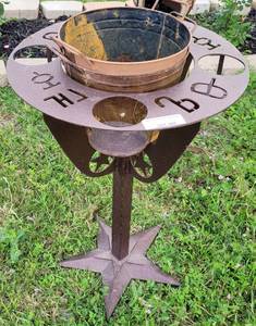 lot 388 image: METAL TABLE WITH CAN HOLDERS AND BUCKET IN STYLE SHOWN.