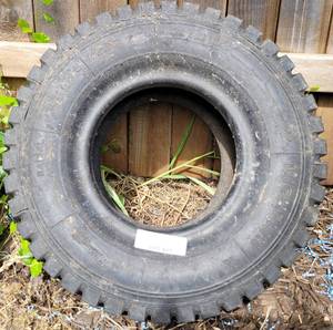 lot 407 image: 18 X 7 R6 TIRE AS SHOWN.