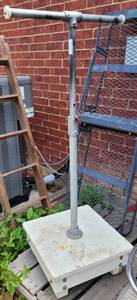 lot 435 image: METAL STAND WITH WOODEN BASE AS SHOWN.