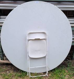 lot 519 image: ROUND FOLDING TABLE AND CHAIR AS SHOWN.