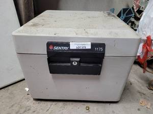 lot 573 image: UPDATED INFO SENTRY HOME FIRE FILE SAFE MODEL 1175 AS SHOWN. WITH KEY.