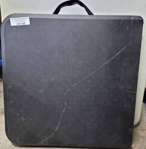 lot 588 image: BLACK FOLDING TABLE AS SHOWN.