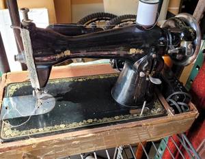 lot 650 image: VINTAGE PORTABLE UNIVERSAL SEWING MACHINE WITH STORAGECARRYING CASE AS SHOWN.