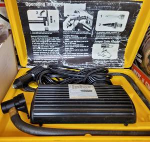 lot 693 image: PORTABLE AIR COMPRESSOR WITH STORAGE CASE AS SHOWN.