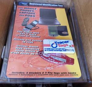 lot 704 image: LOT OF 15 NEW TRACER TAGS REGISTERED ID TAGS FOR PHONES, LAPTOPS AND PDAS AS SHOWN. (YOUR BID X 15)