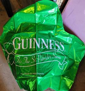 lot 730 image: LOT OF 34 GUINNESS SHAMROCK FOIL BALLOON 3-PACKS IN BOX AS SHOWN. (YOUR BID X 34)