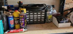 lot 889 image: HARDWARE STORAGE COMPARTMENT BOX, EXTENSION CORD, SCREWS, AND MORE AS SHOWN.