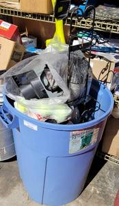 lot 975 image: STERILITE 22 GALLON TRASHCAN WITH CONTENTS INCLUDING TENNIS BALLS, WALL HANGING RACK, AUTOMOTIVE LIGHT, AND MORE AS SHOWN.
