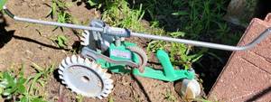 lot 984 image: VINTAGE SEARS CAST IRON TRACTOR SPRINKLER AS SHOWN.