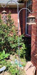 lot 985 image: YARD PLANT HANGER WITH TWO CAST IRON CANDLE HOLDERS AS SHOWN.