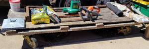 lot 1015 image: LARGE SIZE FLAT BED CART ON CASTERS AS SHOWN. NO CONTENTS ARE INCLUDED. DELAYED PICK UP -- SATURDAY AFTER 400 PM OR SUNDAY