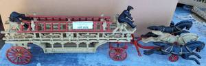 lot 1031 image: VINTAGE CAST IRON HORSE DRAWN FIRE LADDER TRUCK AS SHOWN. APPROX. 14.5 LONG. TAKE A LOOK