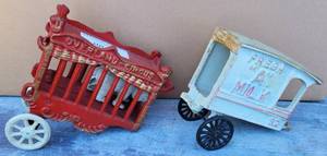 lot 1037 image: LOT OF 2 VINTAGE CAST IRON WAGONS INCLUDING (1) OVERLAND CIRCUS WITH BEAR AND (1) FRESH A MILK AS SHOWN. (YOUR BID X 2)