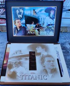 lot 1061 image: TITANIC COLLECTORS EDITION SET INCLUDING 2 NEW VHS TAPES, STORY BOOK, AND SEGMENT OF ORIGINAL FILM IN SPECIAL COLLECTORS BOX AS SHOWN.