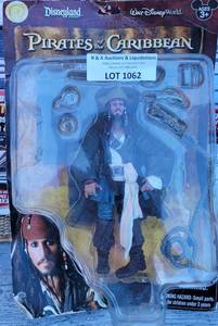 lot 1062 image: PIRATES OF THE CARIBBEAN CAPTAIN JACK SPARROW ACTION FIGURE IN ORIGINAL PACKAGE AS SHOWN.